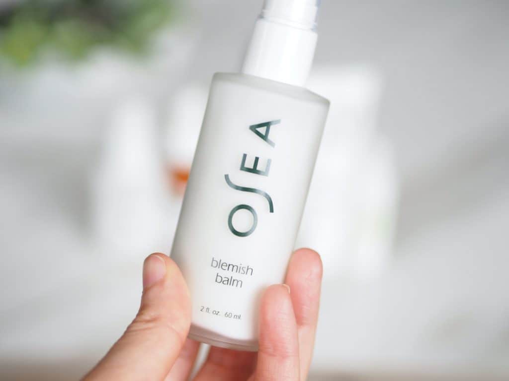 Delilah's hand holding osea blemish balm review