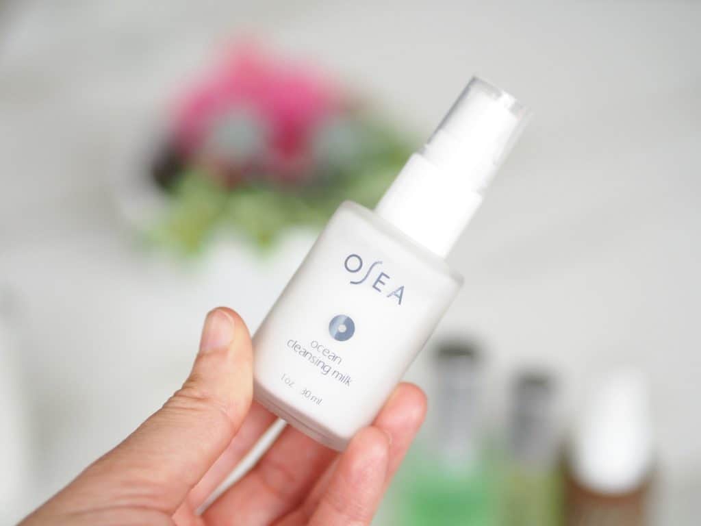 Delilah's hand holding osea malibu ocean cleansing milk review