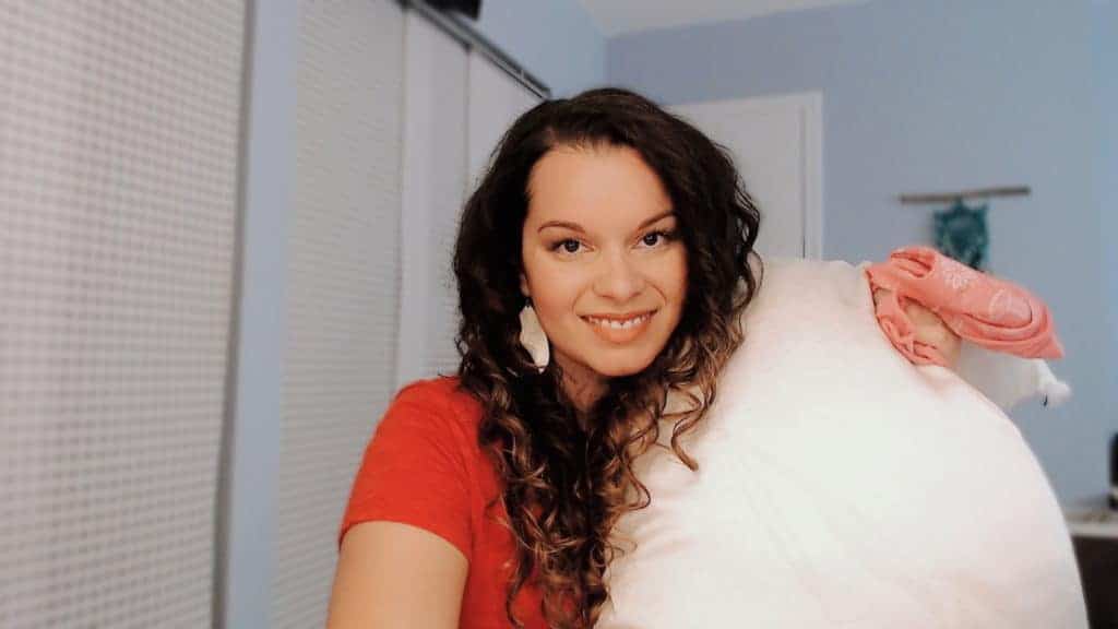 Delilah hold a curly girl silk pillowcase