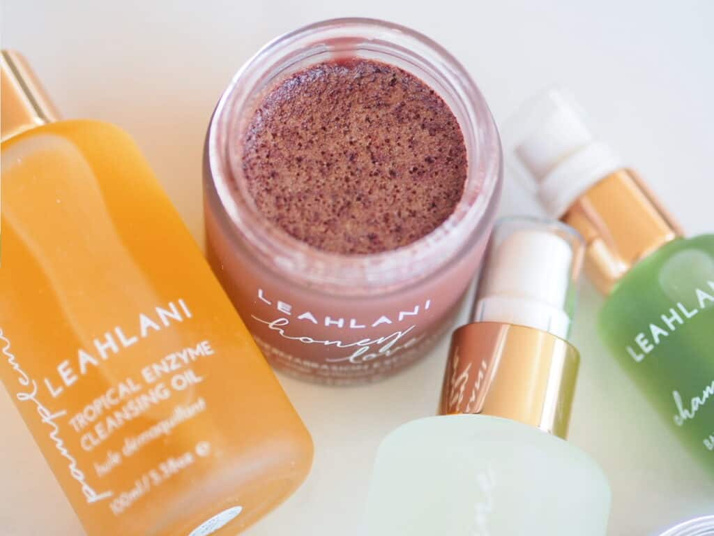 Leahlani Skincare Honey Love and cleansing oil open on counter for brand review