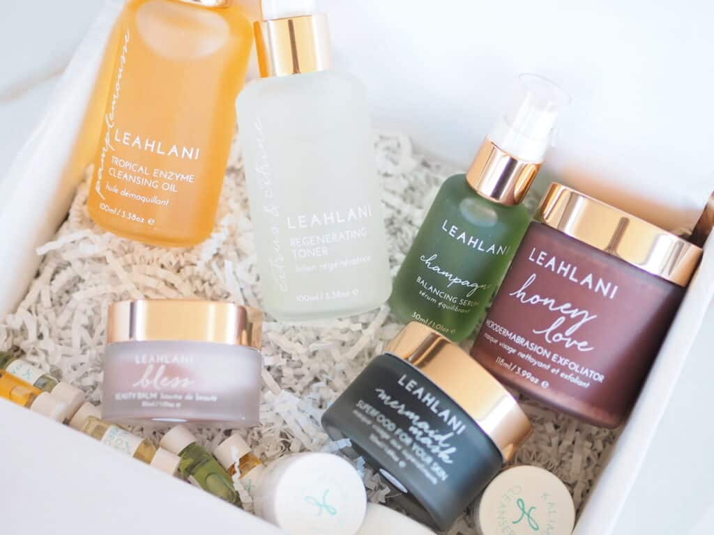 Leahlani Skincare Line oils masks, exfoliator, shampoo, serum, in white box for brand review