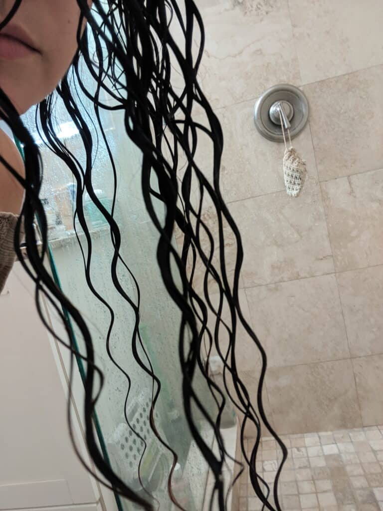 Delilah's wet clumped curls in shower for for frizz free curly hair