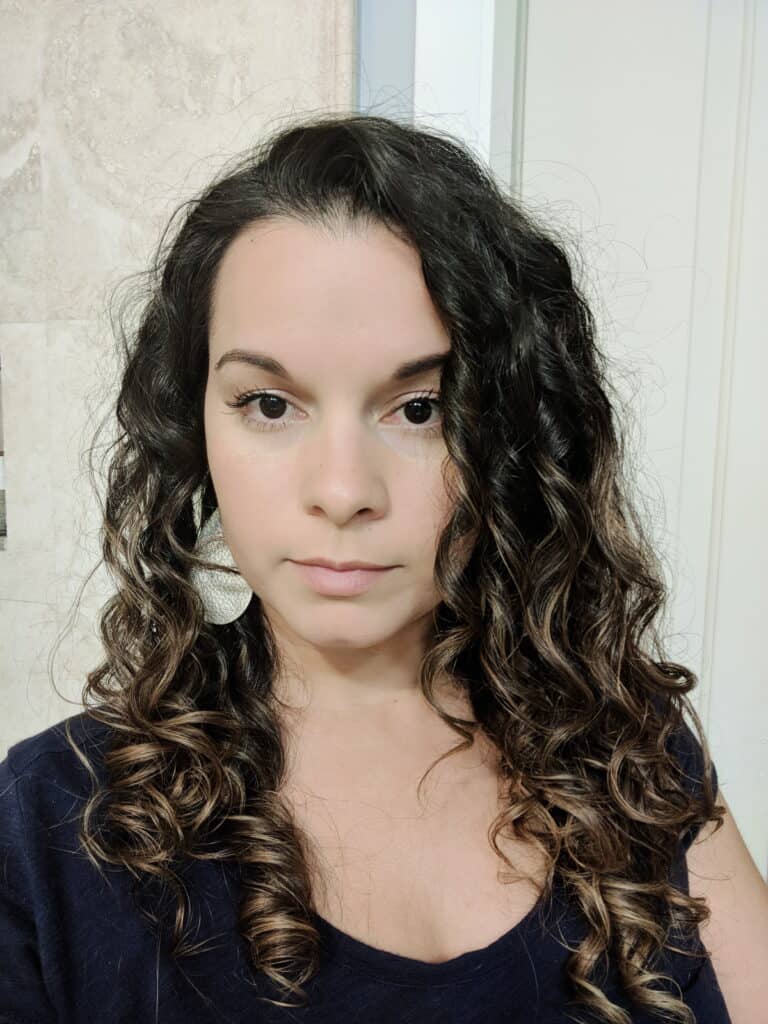 showing curly hair after being outside on a humid rainy day