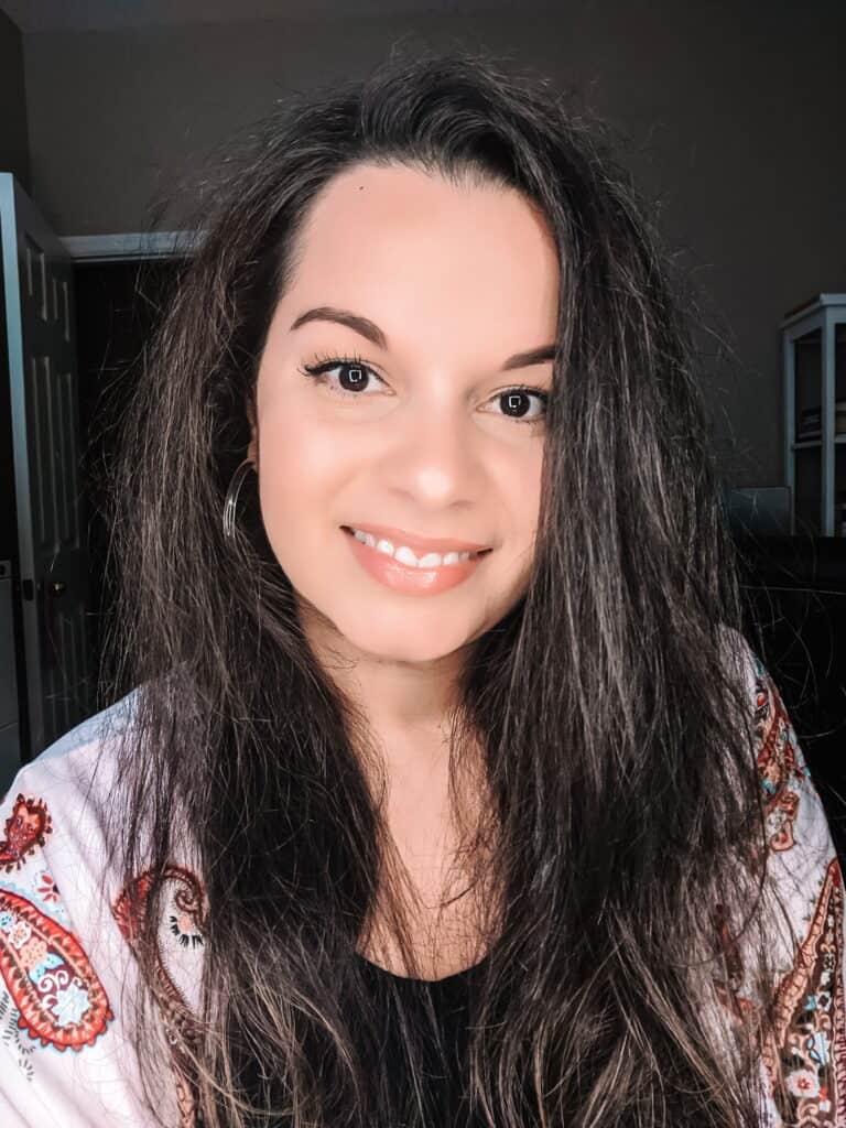 woman with fluffy hair smiling