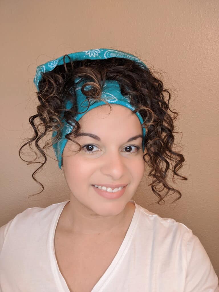 woman wearing hair buff for 3c curly hair sleep protection