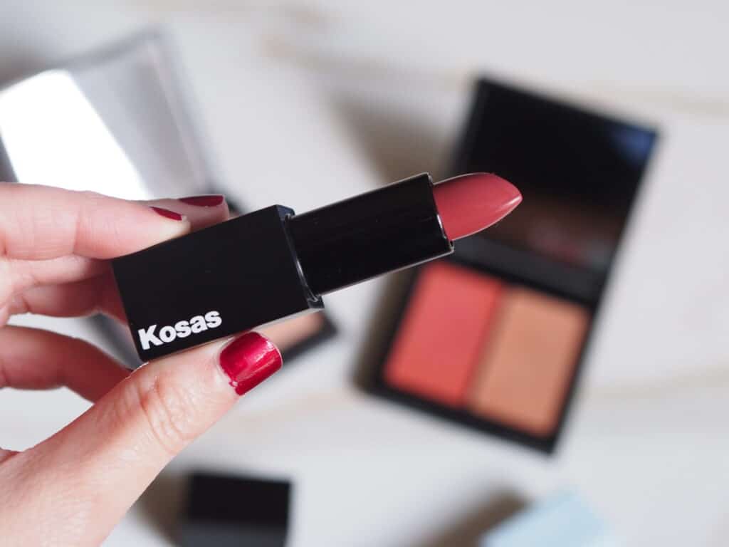 Delilah holding Kosas lipstick Undone for her review