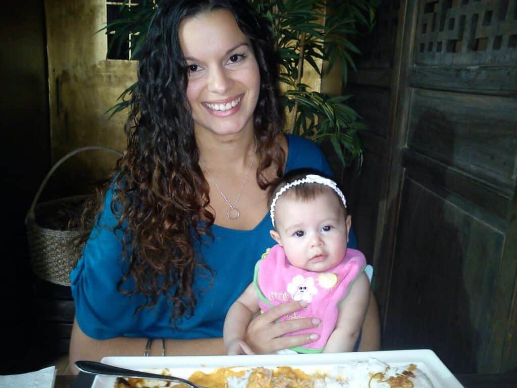 Delilah at the very beginning of her curly girl method journey pictured with daughter