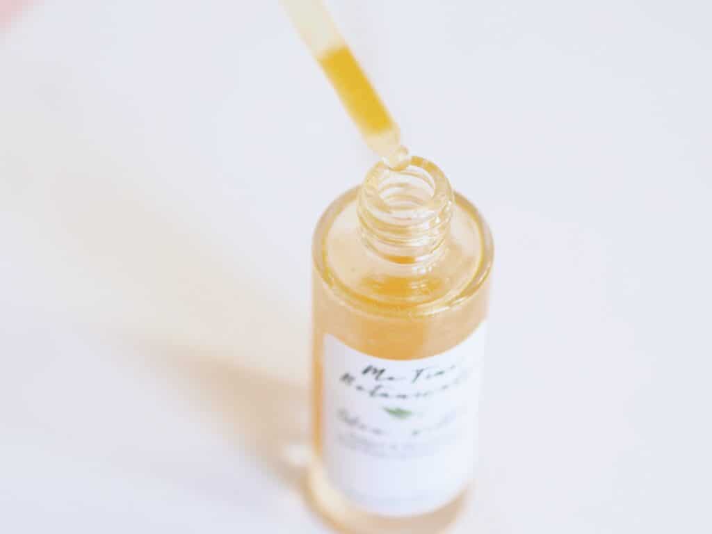 Bottle of Me Time's organic brightening facial serum on counter for Delilah's review