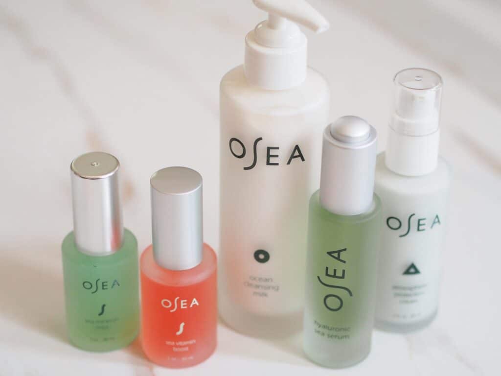 five of the OSEa skincare products line for glowing summer skin on counter in a row