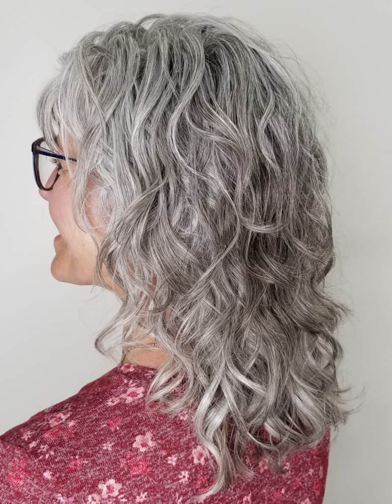 close up of woman with gray curly hair