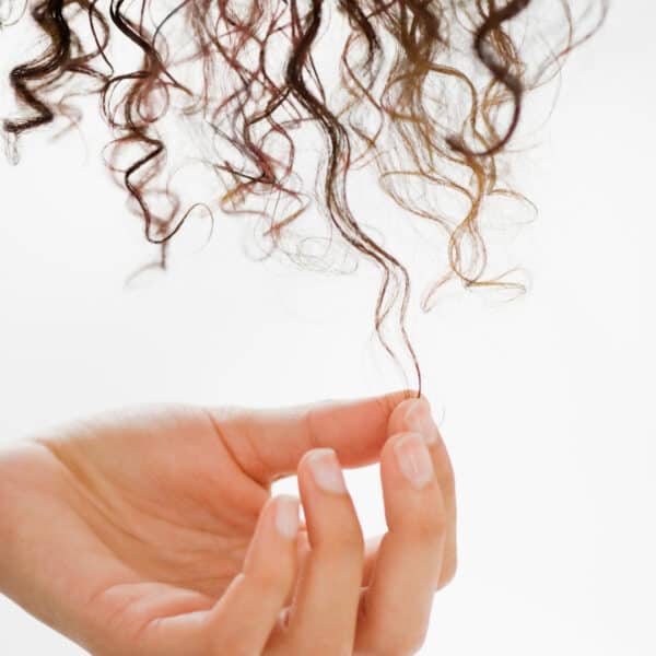 Hair Loss and the Curly Girl Method How To Address Thinning Curly Hair