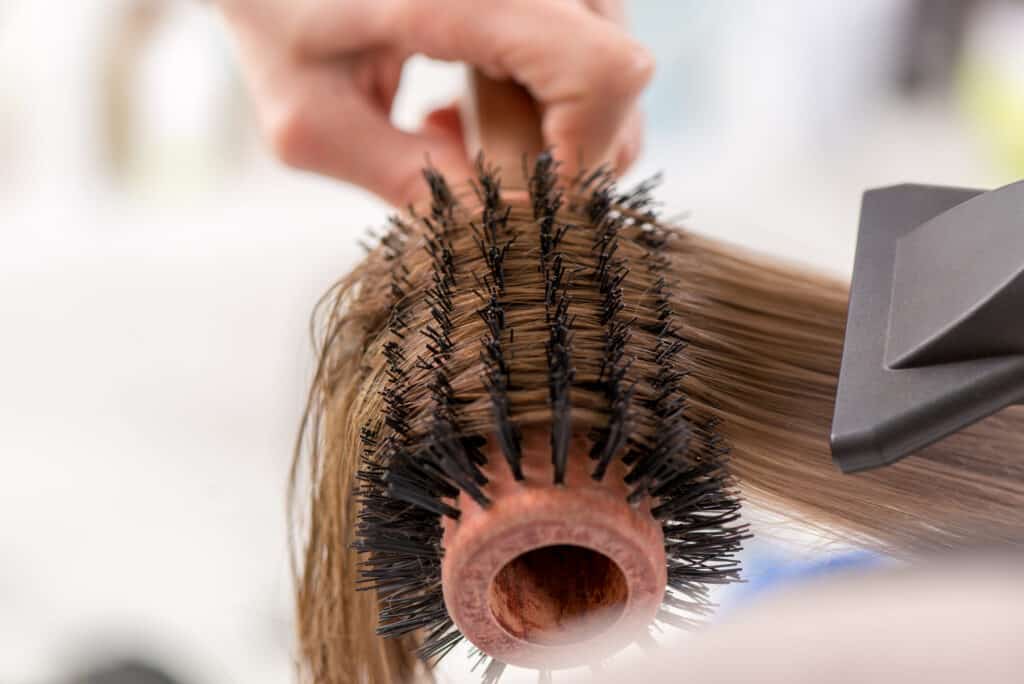 close up of hair brush and dryer during Dominican Blowout