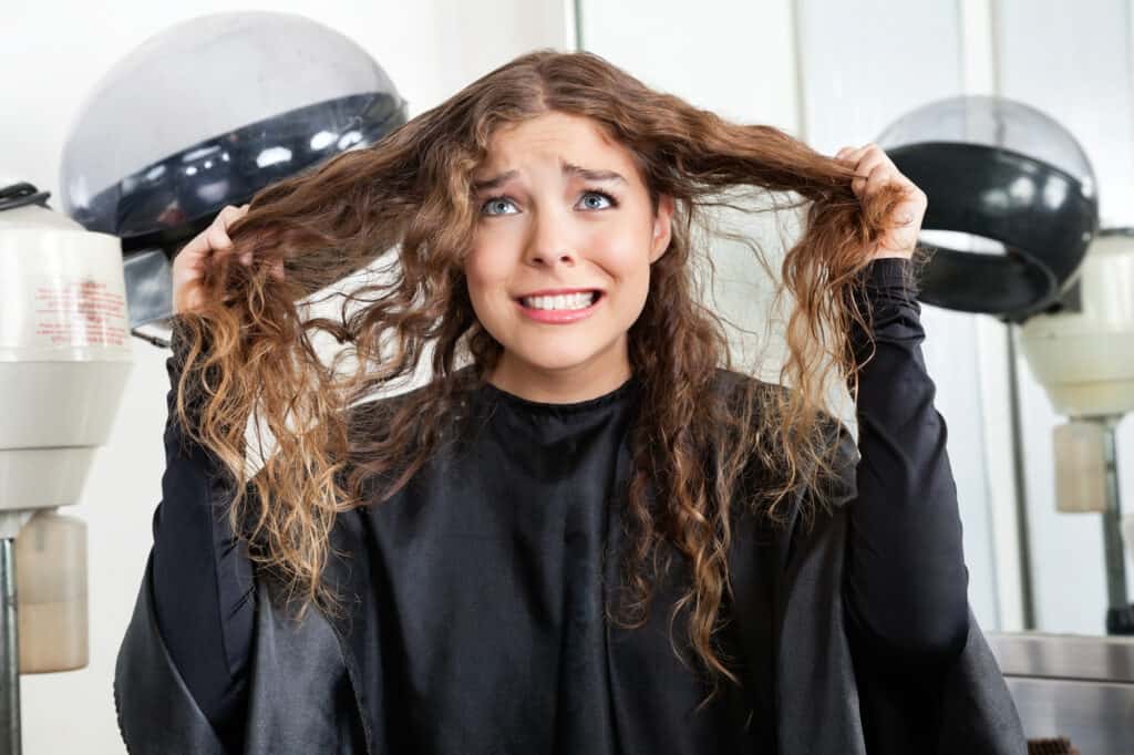 woman with damaged hair at salon