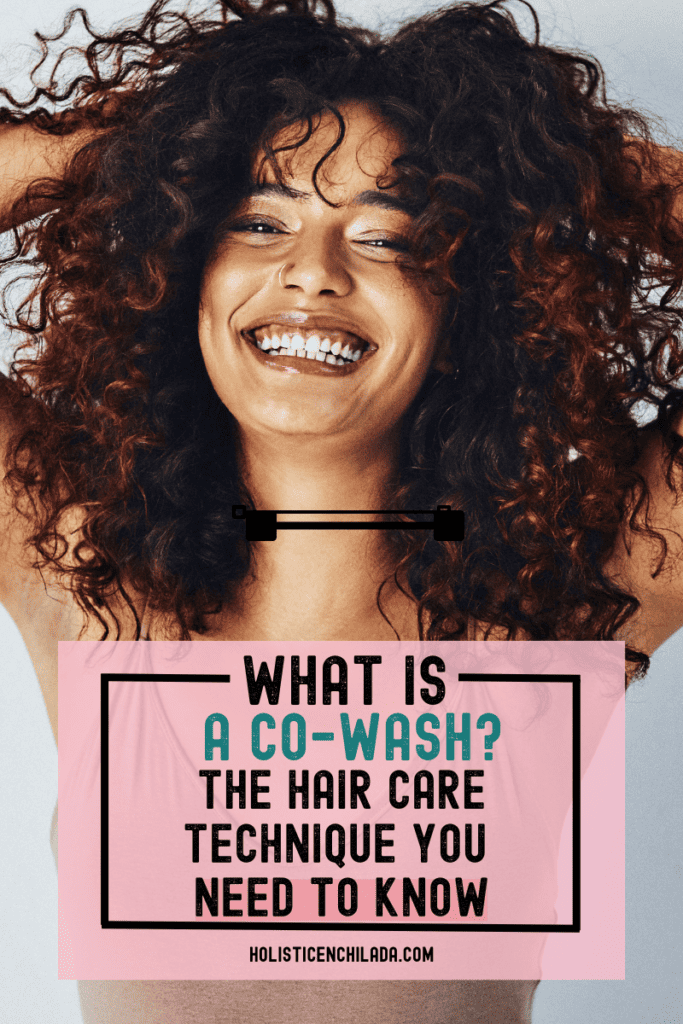 what is a co wash? the hair care technique you need to know text overlay on image of a woman with curly hair smiling with hands on her head