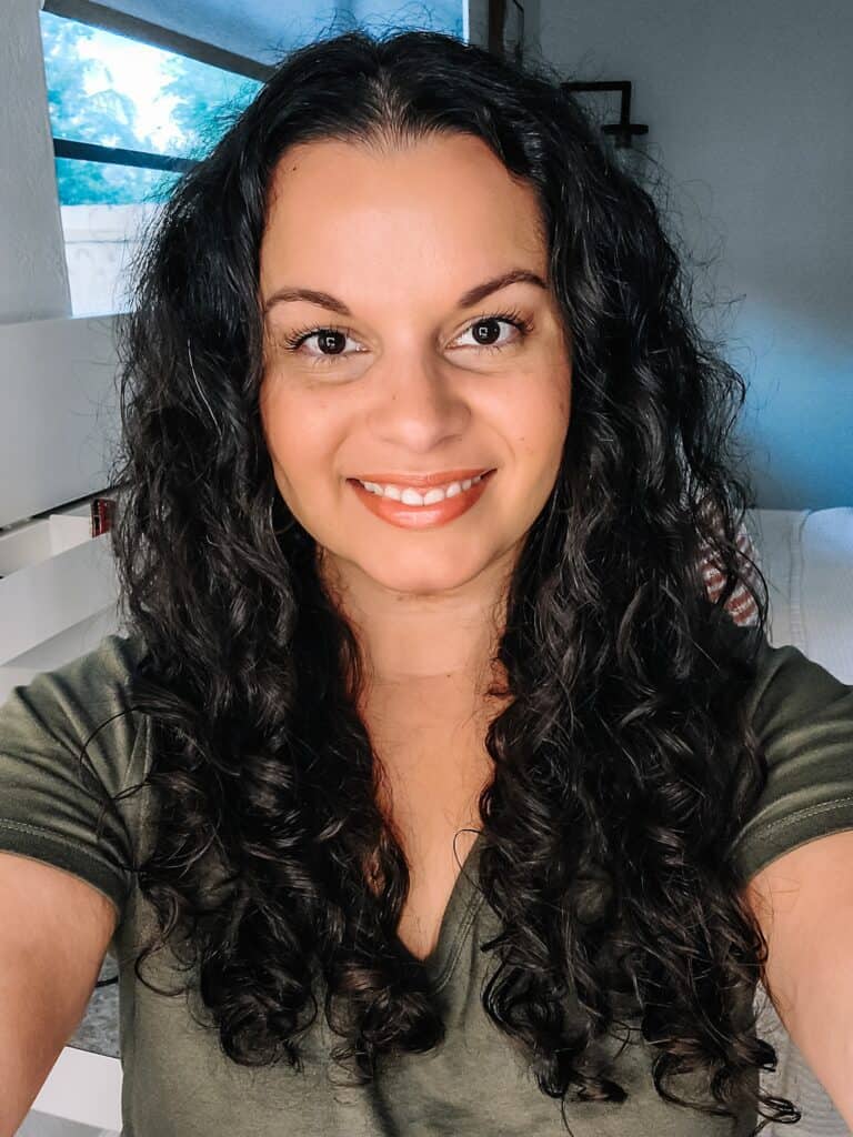 selfie showing my curly hair after using a dandruff shampoo