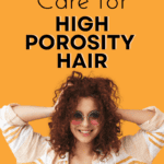 curl haired woman with hands fluffing her hair