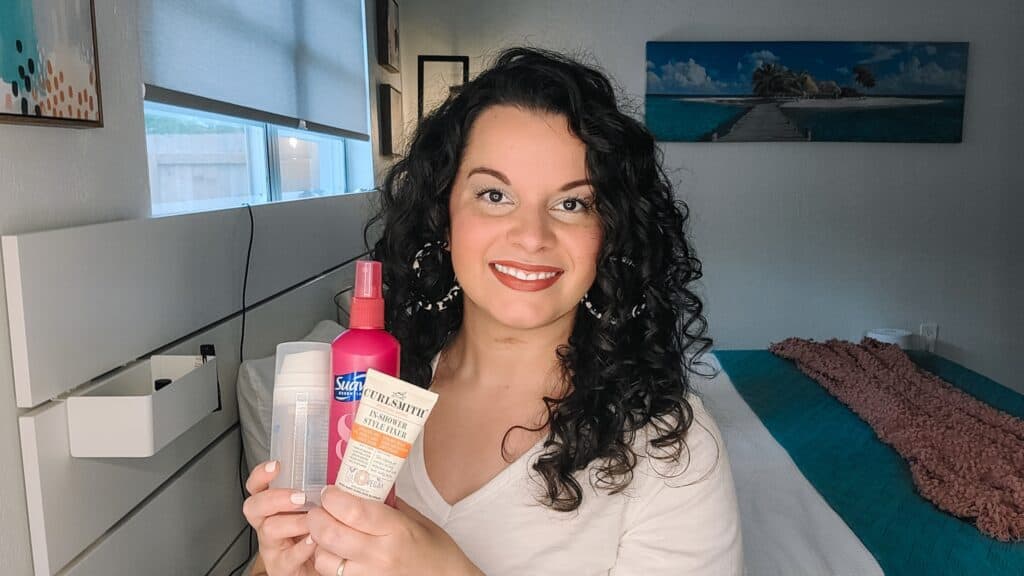holding up products that add grit and texture to curly hair