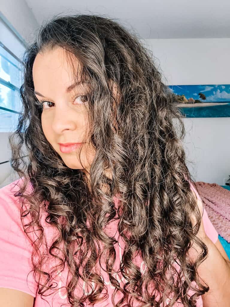 selfie showing styled curly hair with minimal products