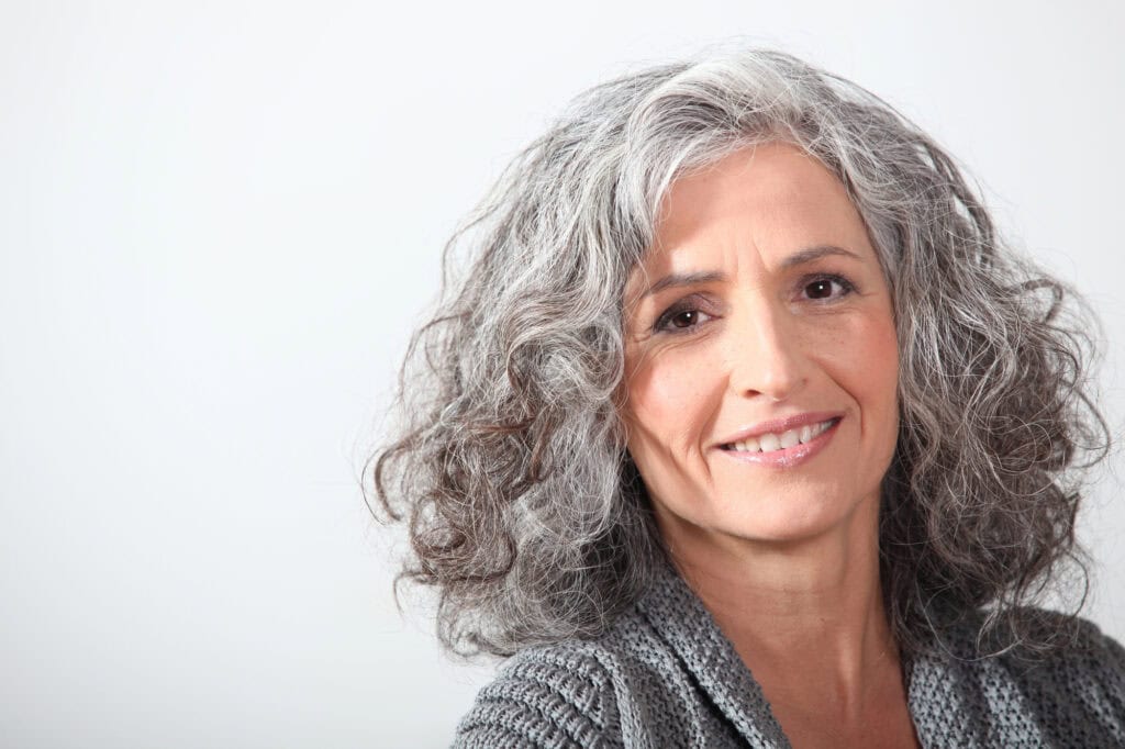woman with gray curly hair
